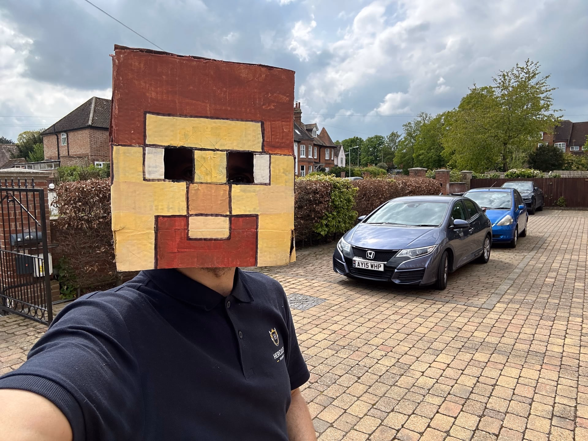 Hercules team member with cardboard mascot head