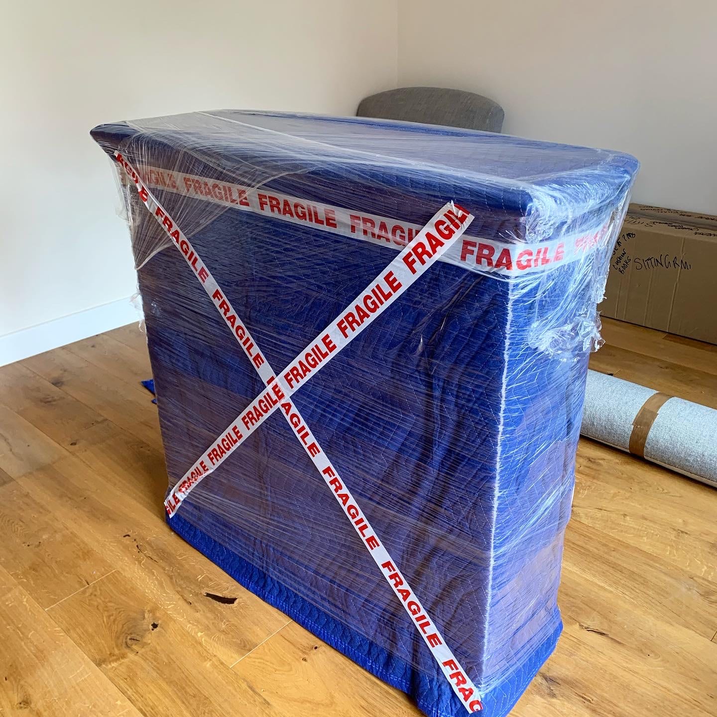 Wrapped furniture sealed with Hercules fragile tape