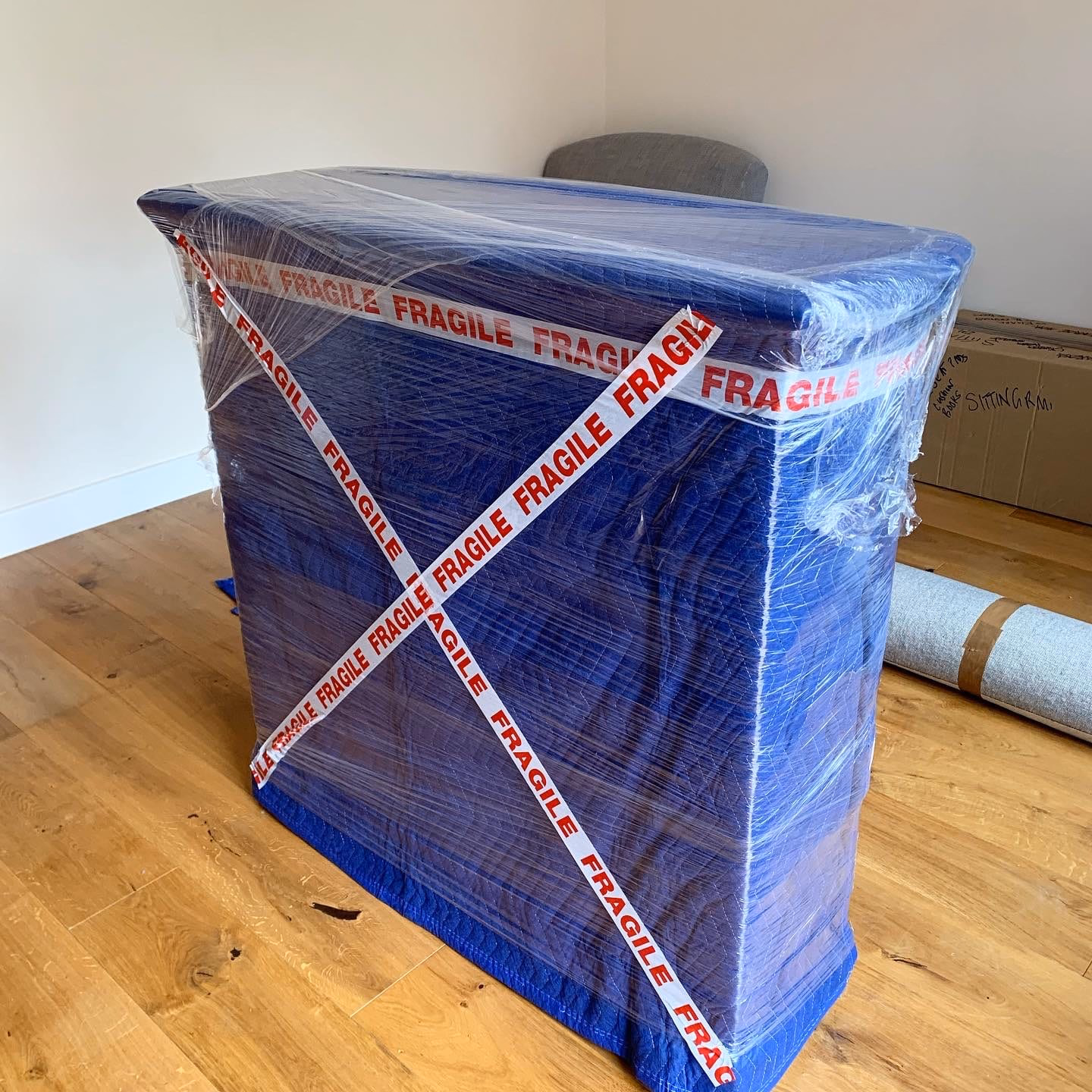Wrapped furniture sealed with Hercules fragile tape